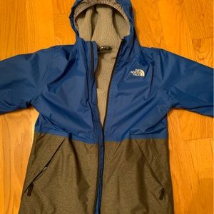 Blue North Face Raincoat Youth Large. Gently used with no tags. Fleece inside